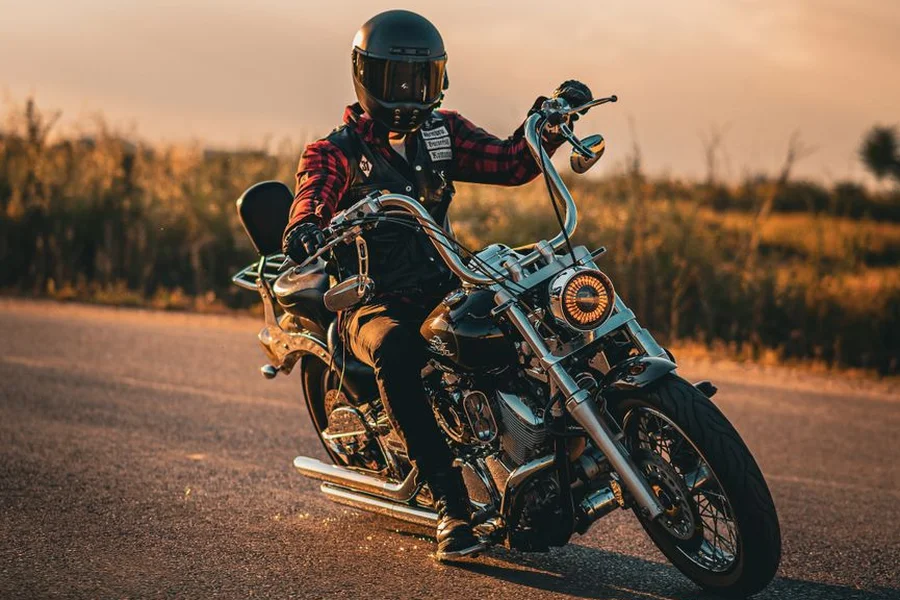 Riding the Suzuki Boulevard M50 Motorcycle rider cruising comfortably on a scenic open road on a middleweight bike