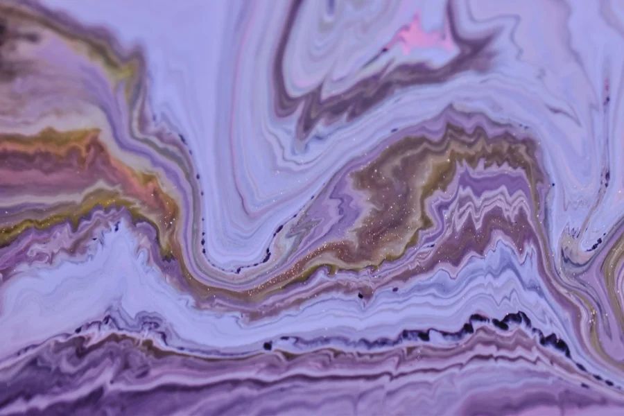Liquid ripple pattern waves in purple and dark colors showing fluid motion