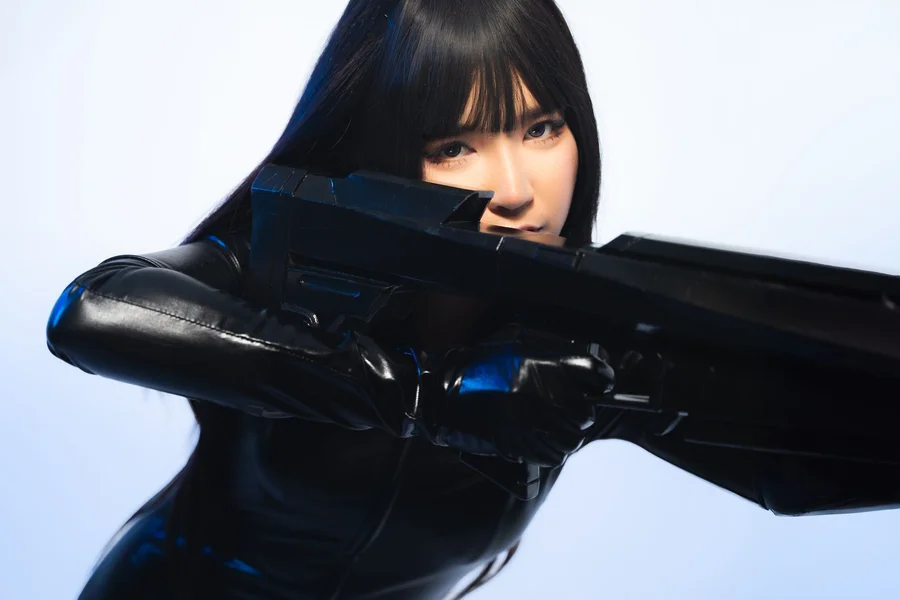 Futuristic anime heroine with glowing armor and high tech weapons