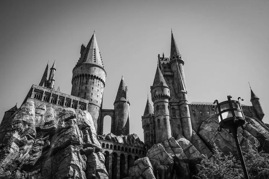 Gothic magical fantasy academy castle with towering spires in a magical kingdom
