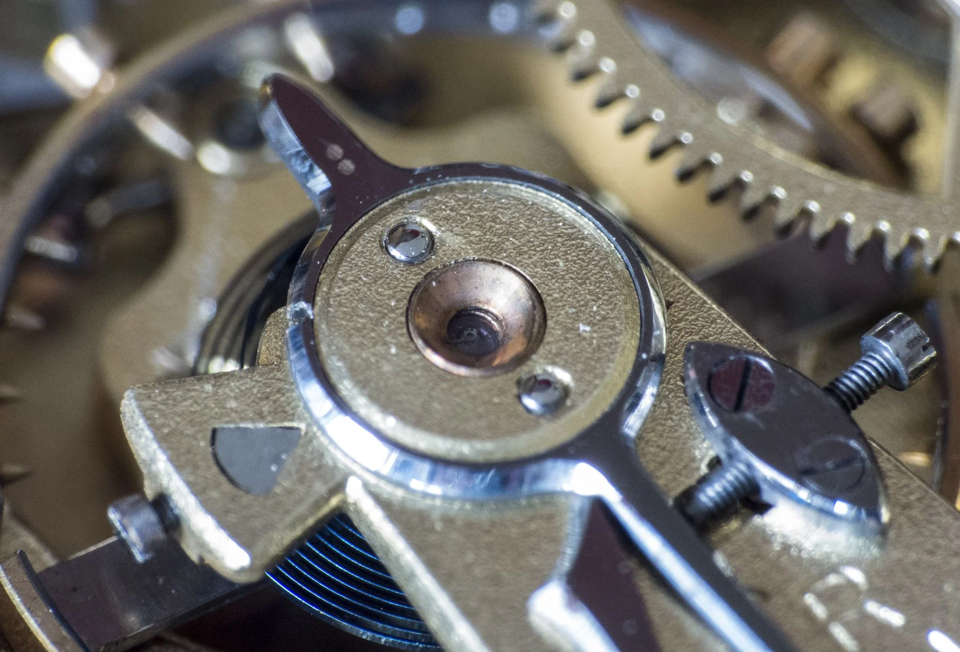 Mechanical automatic watch movement showing balance wheel and winding rotor
