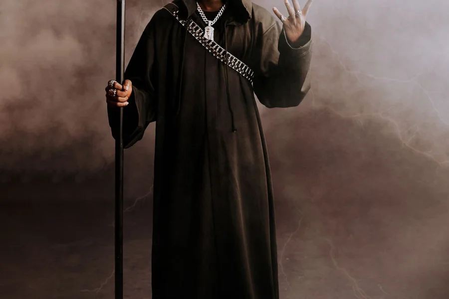 Powerful fantasy wizard channeling glowing lightning and elemental storm magic in a dark battlefield